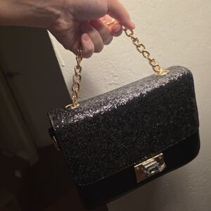 Elegant Black Glitter Gold Toned Chain Bag With Black Crossbody Strap.
